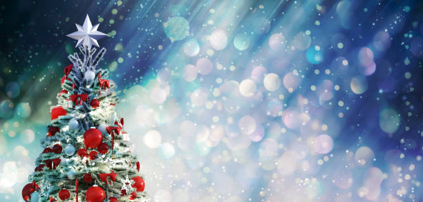 istock Christmas tree against a glittery luminous background 1190863037