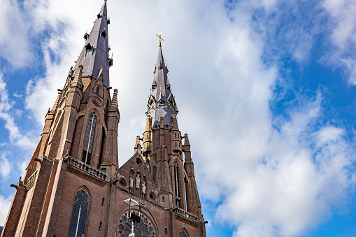 Eindhoven, Netherlands. Saint Catherine Church in the city center. Sint Catharinakerk low angle view, blue sky background