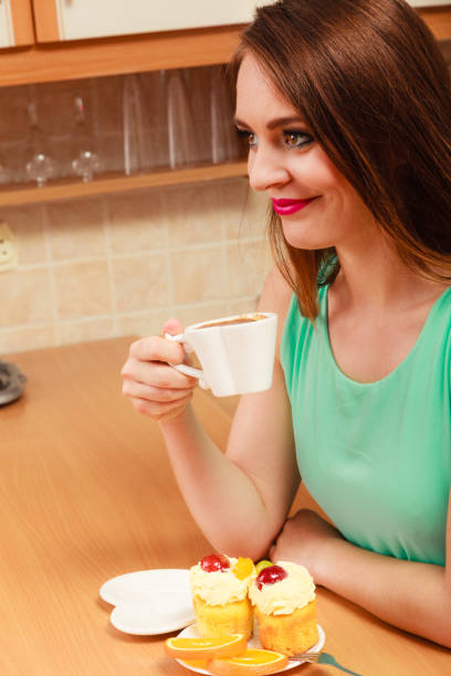 istock Woman drinking coffee and having breakfast. 1190868331