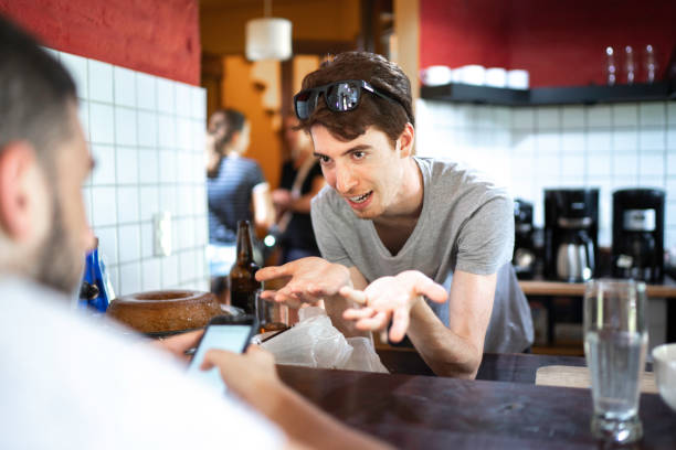 istock Friends/cousin using smartphone and laughing 1190869429