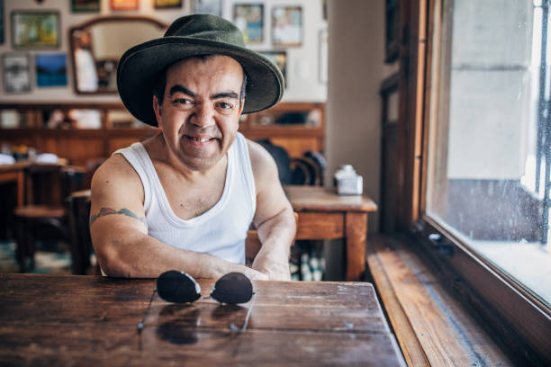 One little adult man sitting in the coffee shop