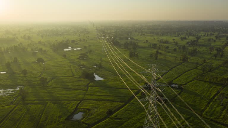 Hyperlapse electricity pylons in the sunrise aerial view