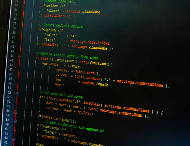 istock JavaScript syntax (jquery) colored by the editor on a dark background. Closer look at the monitor with the program. 1190877437