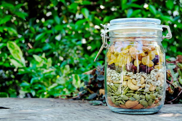 istock The mixed nuts in clear glass container. Healthy food. 1190879046
