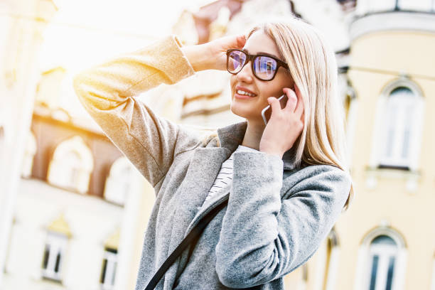 istock Blonde hipster girl using mobile phone for communication 1190884966