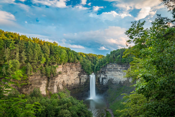 Taughannock Falls Overlook In Summer Time Various views of Taughannock Falls New Your from the overlook just after a storm passed near sunset. finger lakes stock pictures, royalty-free photos & images