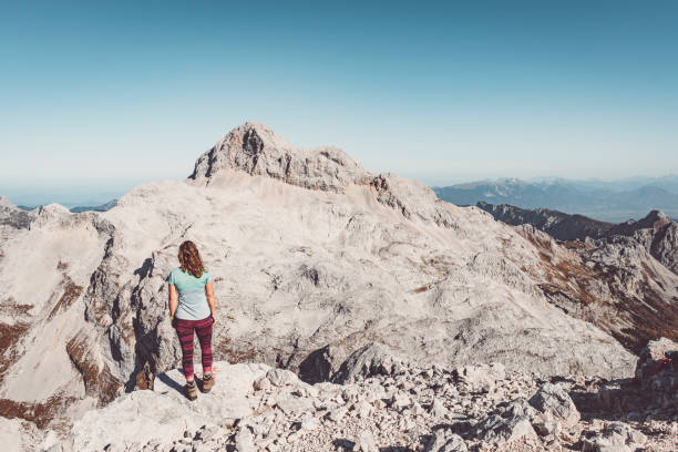 istock Woman hiker enjoying the view from the top 1190886721