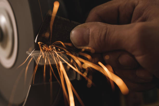Close-up of abrasive disc on bench grinder machine