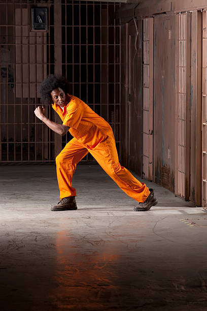 istock Young Man Breaking Out of Prison 119089053