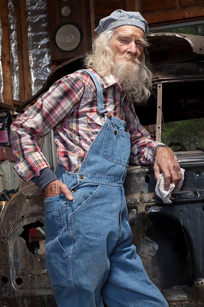 istock Senior Mechanic Posing By Car 119089054