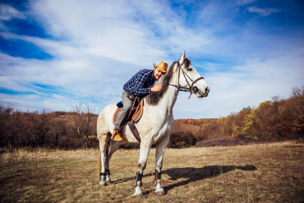 istock Man bonding with his horse 1190893959