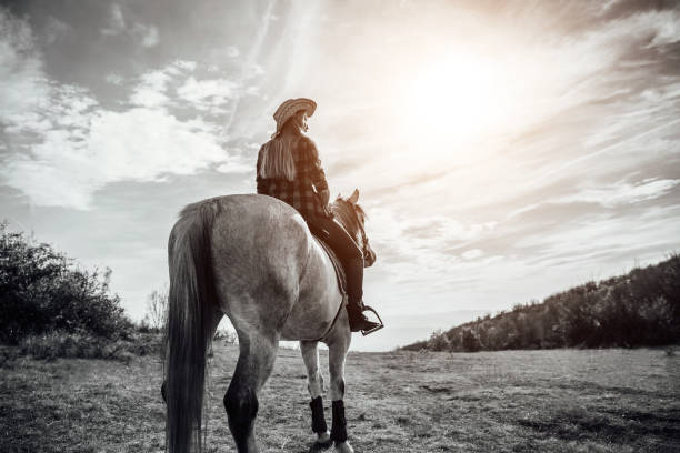 istock Woman riding horse 1190894364