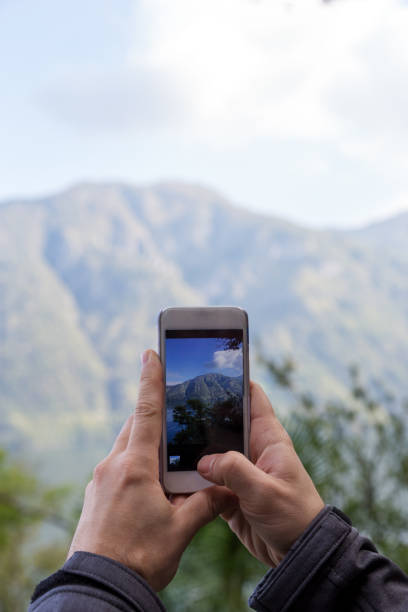 istock smart phone in man's hand photography landscape 1190895367