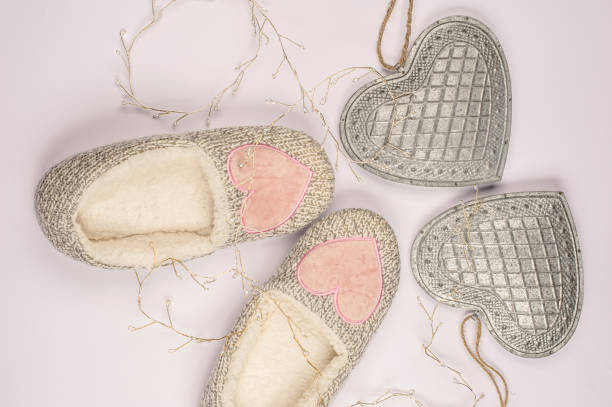 istock Fluffy Home Slippers with Heart Shape Ornaments on White Background 1190902760