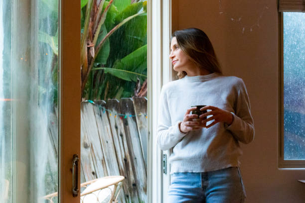 Cozy Woman at home on a rainy day woman hot shower stock pictures, royalty-free photos & images