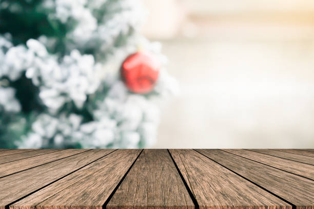 istock abstract blur decorated christmas ornament pine tree with red bauble in home interior background with wood perspective tabletop for show,ads,design product on display concept in merry xmas and happy new year season concept 1190903021
