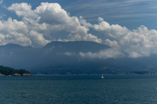 istock Coastal mountains almost hidden behind the clouds on the Pacific Ocean, BC, Canada 1190903383