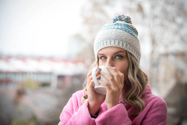 istock Beautiful young woman drinking coffee 1190904630