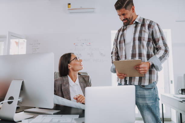 istock Two businesspeople having a discussion in an office 1190906621