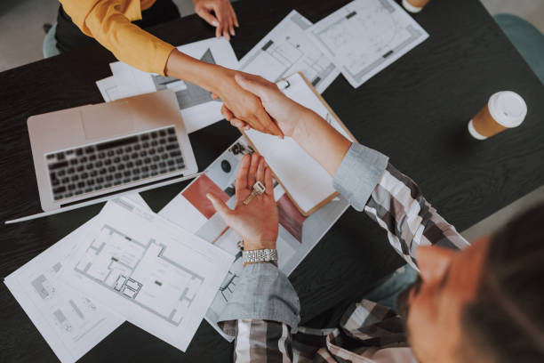 istock Close up of designer and client completing a collaboration 1190906764