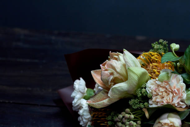 detail closeup bouquet in pastel colors in vintage style on a dark background, selective focus - flower head bouquet built structure carnation imagens e fotografias de stock