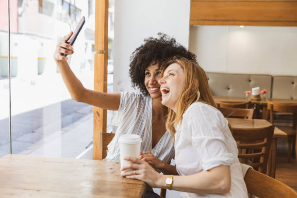 istock Happy selfie with a friend in a cafe 1190909127
