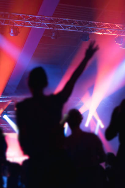 istock people enjoying a party with many colorful lights 1190910504