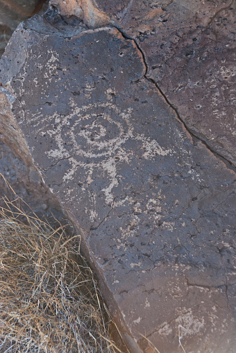Nearly a thousand years ago natives inhabited the lower elevations around the San Francisco Peaks of Arizona. In an area so dry it would seem impossible to live, they built pueblos, harvested rainwater, grew crops and raised families. Today the remnants of their villages dot the landscape along with their other artifacts. These petroglyphs were found on South Mesa in Wupatki National Monument near Flagstaff, Arizona, USA.