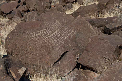 Nearly a thousand years ago natives inhabited the lower elevations around the San Francisco Peaks of Arizona.  In an area so dry it would seem impossible to live, they built pueblos, harvested rainwater, grew crops and raised families.  Today the remnants of their villages dot the landscape along with their other artifacts.  These petroglyphs were found on Magnetic Mesa in Wupatki National Monument near Flagstaff, Arizona, USA.