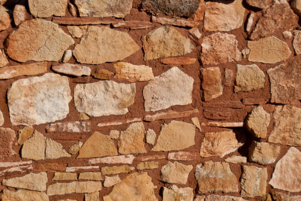 Between 1100AD and 1200AD native people inhabited the plains between the Painted Desert and the San Francisco Peaks of Arizona.  In an area so dry it would seem impossible to live, they built pueblos, harvested rainwater, grew crops and raised families.  Their way of life was the key to survival in this harsh landscape.  These people survived here, farming one of the warmest and driest places on the Colorado Plateau.  They developed the skills to farm the land and endure hardship in an area where many would not.  Today the remnants of their villages dot the landscape.  Kaibab House Pueblo is in Wupatki National Monument, established in 1924 to preserve this rich heritage.  Wupatki National Monument is near Flagstaff, Arizona, USA.