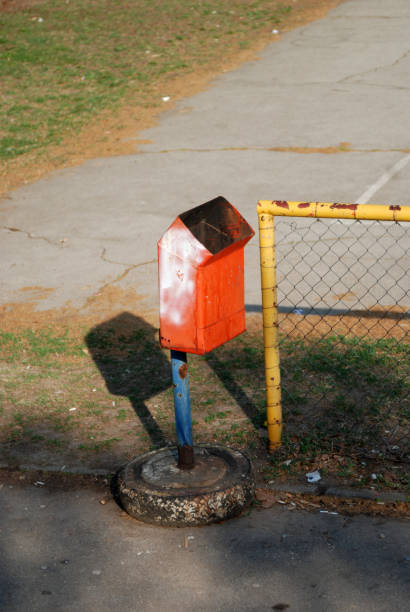 istock Garbage can by the fence. 1190916459