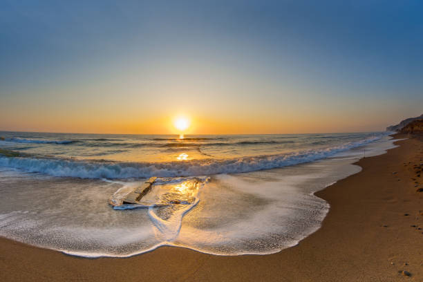 istock Dawn by the sea 1190917636