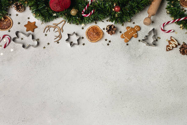 istock Christmas composition flat lay, tinsel, gingerbread, cookie cutter, candy cane, dried orange, ornaments, pinecone 1190917881