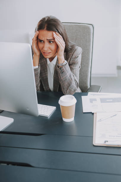 istock Upset businesswoman is working at her office 1190919537