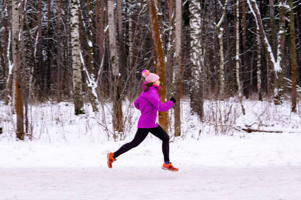 istock young woman jogging on a winter day 1190923549