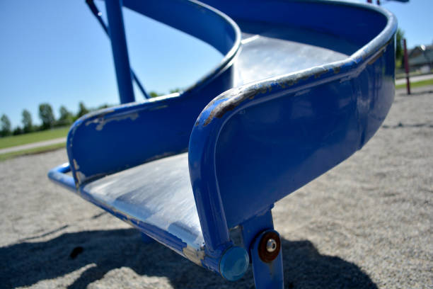 istock Colourful playground slide in school yard with school in background 1190924464