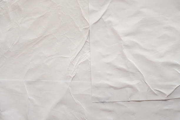 istock Blank white crumpled and creased paper poster texture background 1190927538