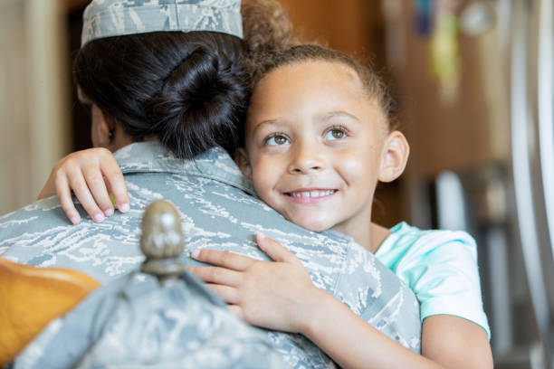 istock Daughter hugging military mom 1190927693