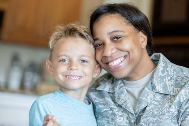 istock Soldier mom smiling with young son 1190927696