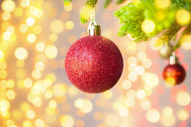istock Christmas tree decorated with red ball on pine branches background 1190927969