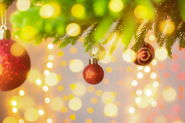 istock Christmas tree decorated with red ball on pine branches background 1190927970