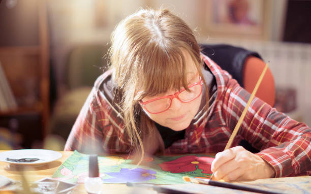 istock Artist working on a painting at home studio 1190934351