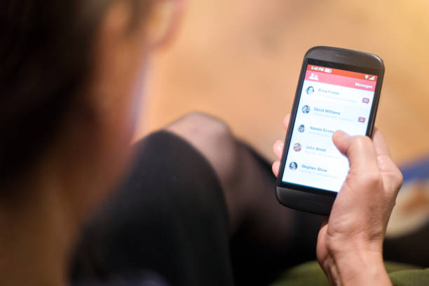 istock Middle aged woman checking her messages a smartphone 1190934501