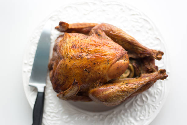 istock Beautiful Roasted Turkey on Fancy White Platter, White Background 1190934511