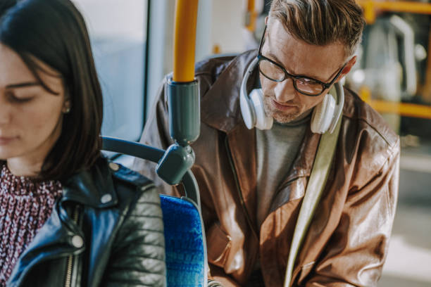 istock Attractive stylish man taking a ride on tram 1190936630