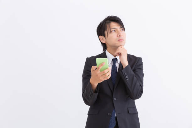 istock businessman who uses smart phone,think, 1190938301