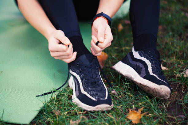 istock Sportswoman tying shoes 1190938961