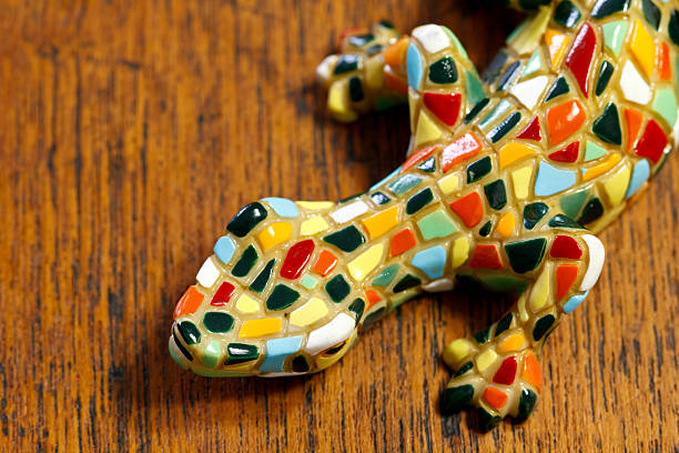 Detailed view of the world-famous lizard fountain in the public garden of Parc Guell designed and built by the spanish architect Antoni Gaudi in 1900-1914. The location is Barcelona, Spain.
