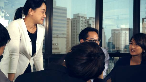 istock Asian business people discuss marketing strategy. 1190952928
