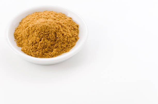 istock Cumin Powder in Small ceramic dish on White Background 1190953359